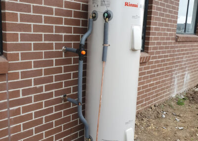 Hot water system beside house