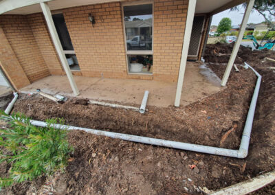 Drainage pipes beside home